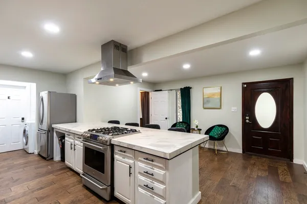 a kitchen with a stove and a sink