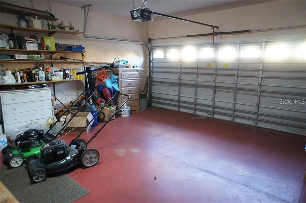 5948 Winchester Isle Road Orlando, FL 32829 - Photo 19 of 23 a view of a storage room with a lot of stuff