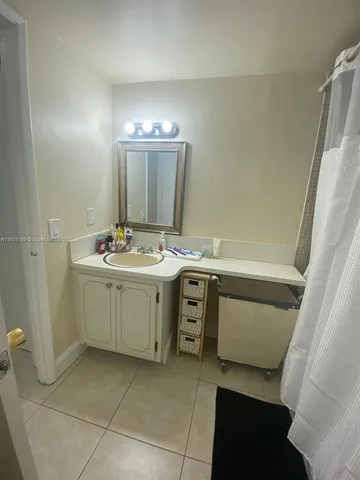 a utility room with sink dryer and washer