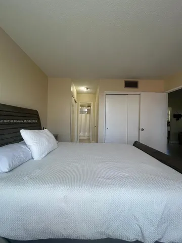 a view of a room that has a bed