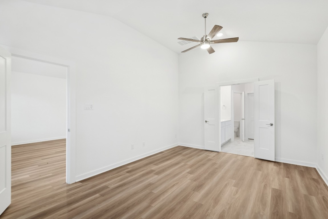 3422 Fresh Bluestream Lane Rosenberg, TX 77471 - Photo 31 of 48 a view of a room with wooden floor and a ceiling fan