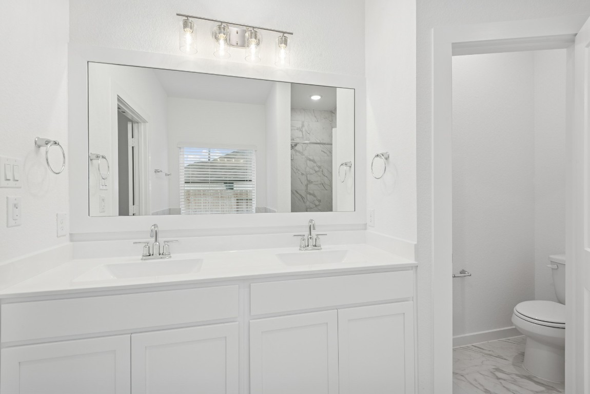 3422 Fresh Bluestream Lane Rosenberg, TX 77471 - Photo 33 of 48 a bathroom with a sink and a mirror