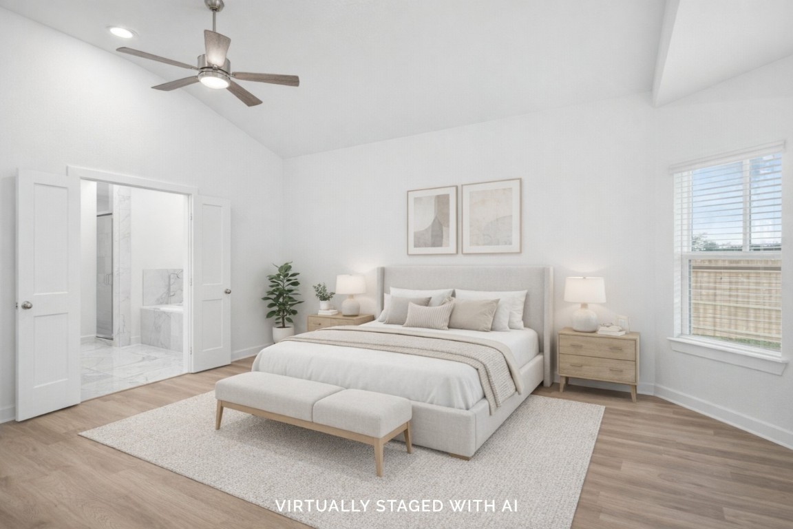 3422 Fresh Bluestream Lane Rosenberg, TX 77471 - Photo 4 of 48 a bedroom with a large bed chandelier and a window