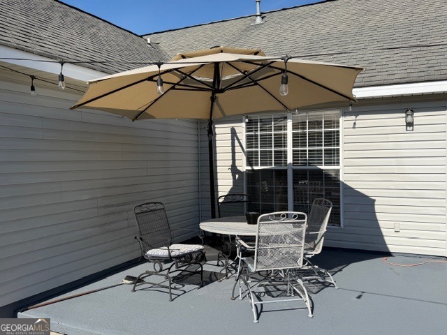 104 Tyler Court Macon, GA 31216 - Photo 12 of 33 a patio with a table and chairs