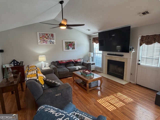 104 Tyler Court Macon, GA 31216 - Photo 15 of 33 a living room with furniture a flat screen tv and a fireplace