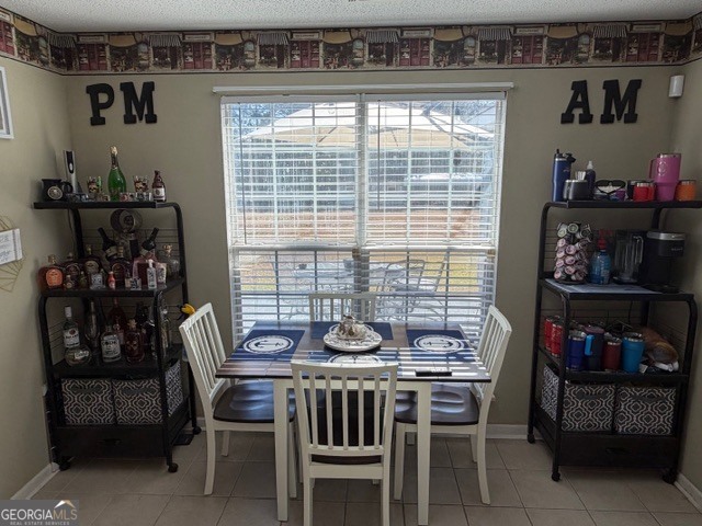 104 Tyler Court Macon, GA 31216 - Photo 16 of 33 a table and chairs in a room and a window