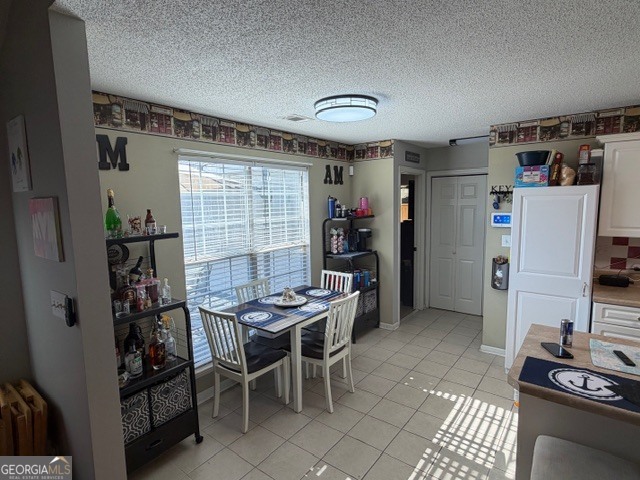 104 Tyler Court Macon, GA 31216 - Photo 17 of 33 a dining room with furniture and a window
