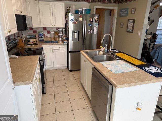 104 Tyler Court Macon, GA 31216 - Photo 19 of 33 a kitchen with a sink a stove and a refrigerator