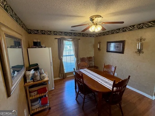 a room with furniture and wooden floor
