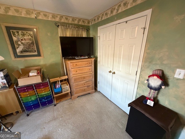 104 Tyler Court Macon, GA 31216 - Photo 24 of 33 a room with furniture and flat screen tv