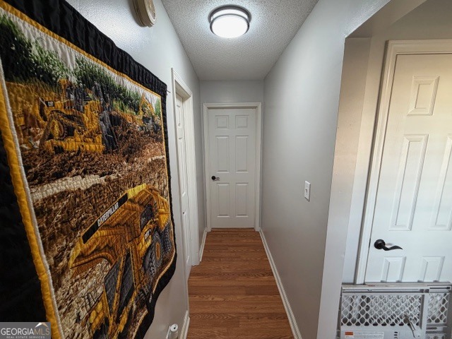 104 Tyler Court Macon, GA 31216 - Photo 25 of 33 a view of a hallway with wooden floor and a door