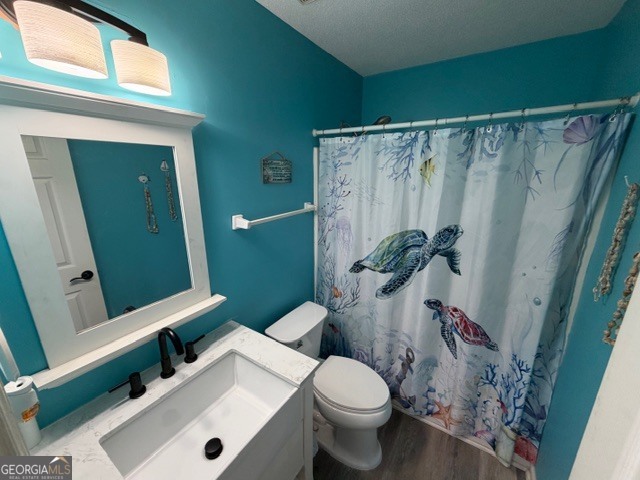 104 Tyler Court Macon, GA 31216 - Photo 26 of 33 a white toilet sitting next to a bathroom sink and a shower