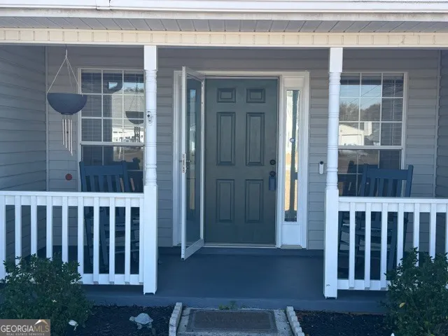 a view of porch with a chair