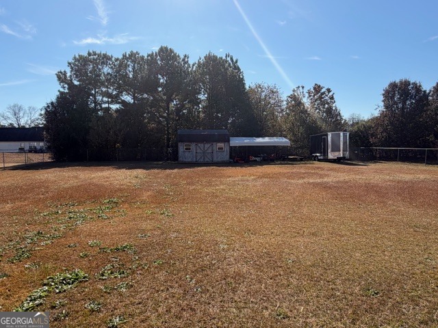 104 Tyler Court Macon, GA 31216 - Photo 6 of 33 a swimming pool with trees in front of it