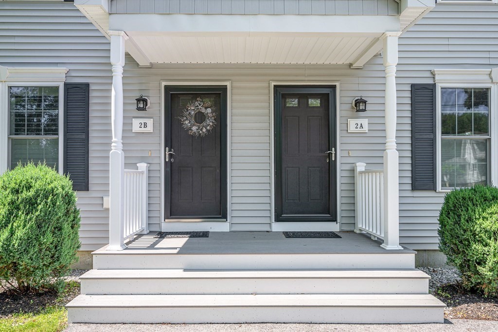 2a Ferry Road, Unit B Salisbury, MA 01952 - Photo 1 of 22 a front view of a house with potted plants