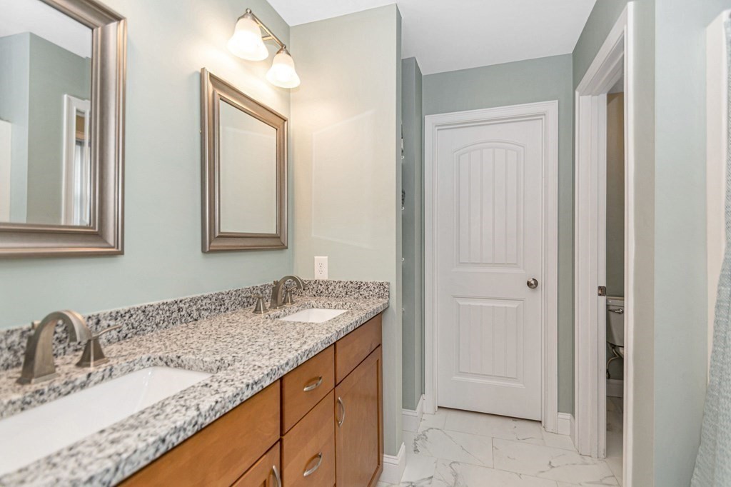 2a Ferry Road, Unit B Salisbury, MA 01952 - Photo 13 of 22 a bathroom with a granite countertop sink and a mirror