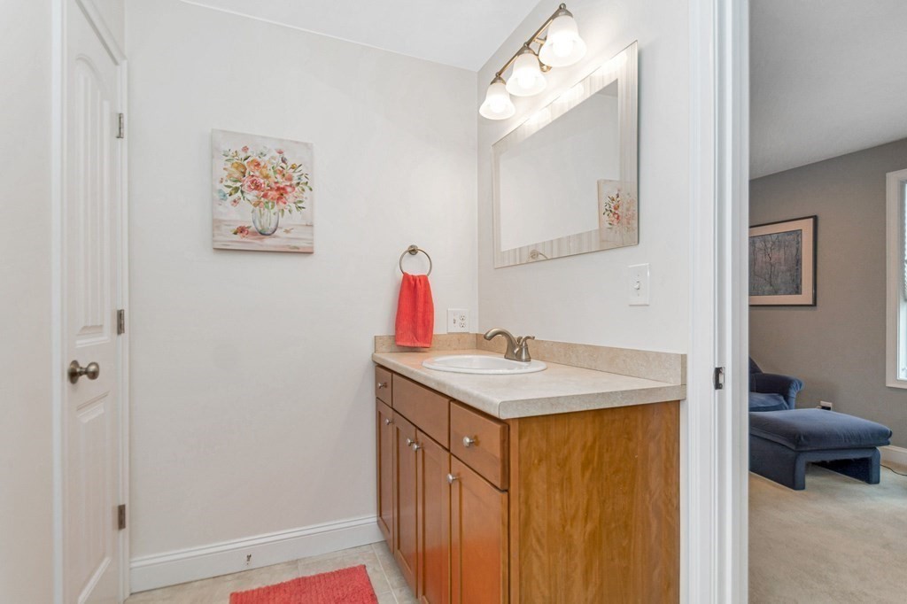 2a Ferry Road, Unit B Salisbury, MA 01952 - Photo 16 of 22 a bathroom with a sink vanity and a mirror