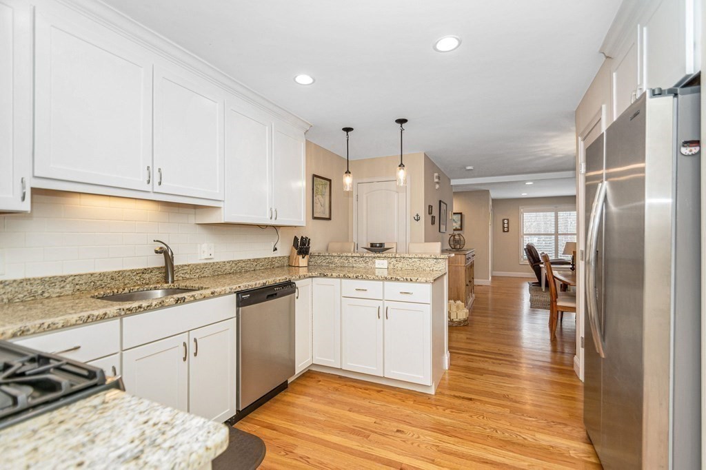 2a Ferry Road, Unit B Salisbury, MA 01952 - Photo 2 of 22 a kitchen with a sink a stove cabinets and wooden floor