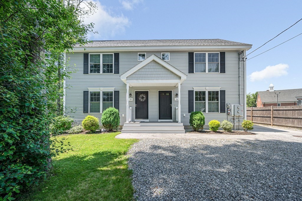 2a Ferry Road, Unit B Salisbury, MA 01952 - Photo 22 of 22 a front view of a house with a yard and outdoor seating