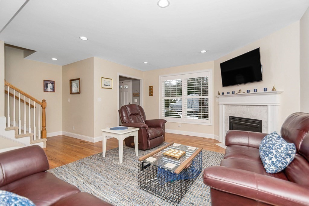 2a Ferry Road, Unit B Salisbury, MA 01952 - Photo 4 of 22 a living room with furniture a flat screen tv and a fireplace