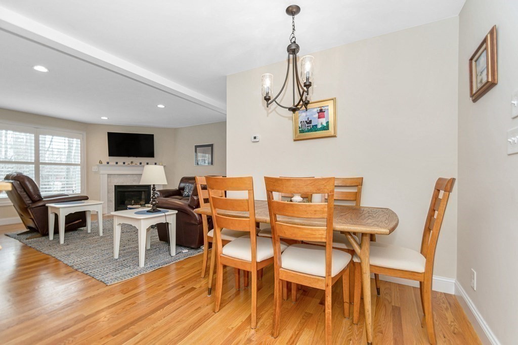 2a Ferry Road, Unit B Salisbury, MA 01952 - Photo 6 of 22 a view of a dining room with furniture a rug and wooden floor