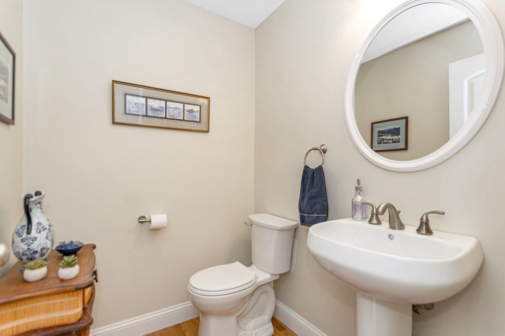 2a Ferry Road, Unit B Salisbury, MA 01952 - Photo 10 of 22 a bathroom with a sink mirror and toilet