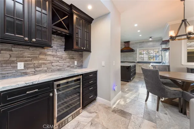 a kitchen with stainless steel appliances granite countertop a sink and cabinets