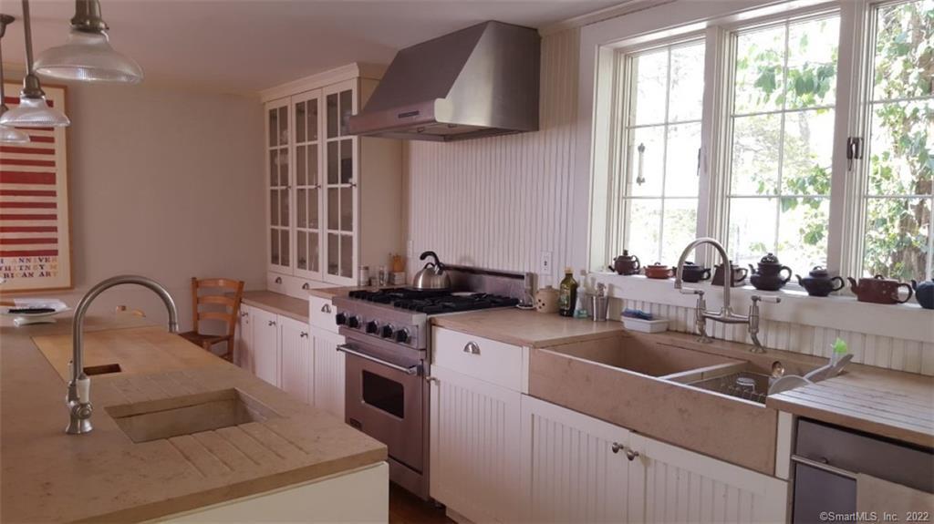 261 Taconic Road Salisbury, CT 06068 - Photo 2 of 20 a kitchen with a sink cabinets and a stove