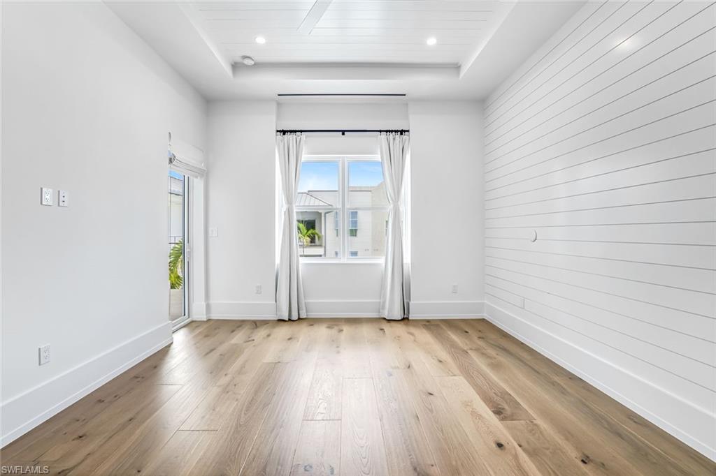 201 8th Street South, Unit 308 Naples, FL 34102 - Photo 13 of 28 a view of wooden floor in an empty room
