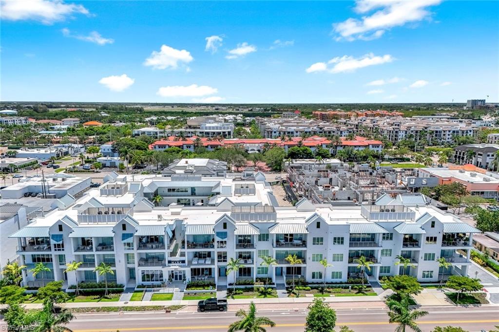 201 8th Street South, Unit 308 Naples, FL 34102 - Photo 2 of 28 a view of city with tall buildings