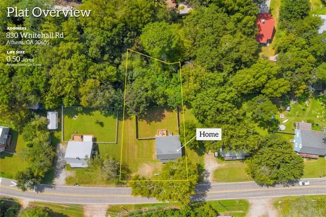 an aerial view of a house with swimming pool