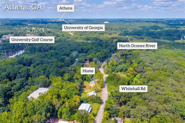 a sign broad in front of red brick house