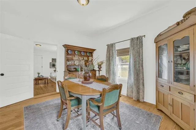 a view of a dining room with furniture and window