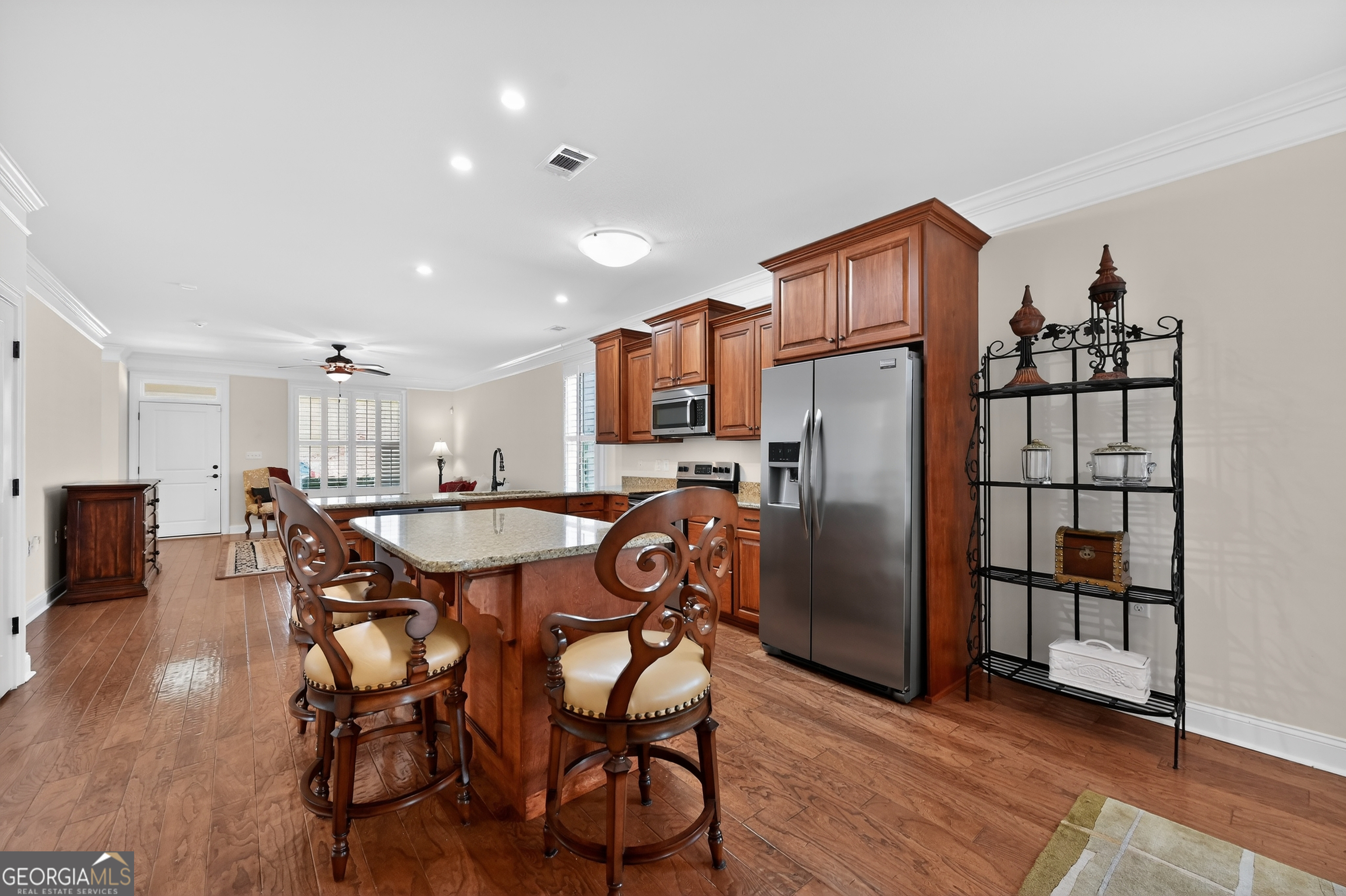 1617 Red Oak Lane Albany, GA 31701 - Photo 13 of 36 a dining area with stainless steel appliances kitchen island granite countertop a dining table chairs and granite counter tops