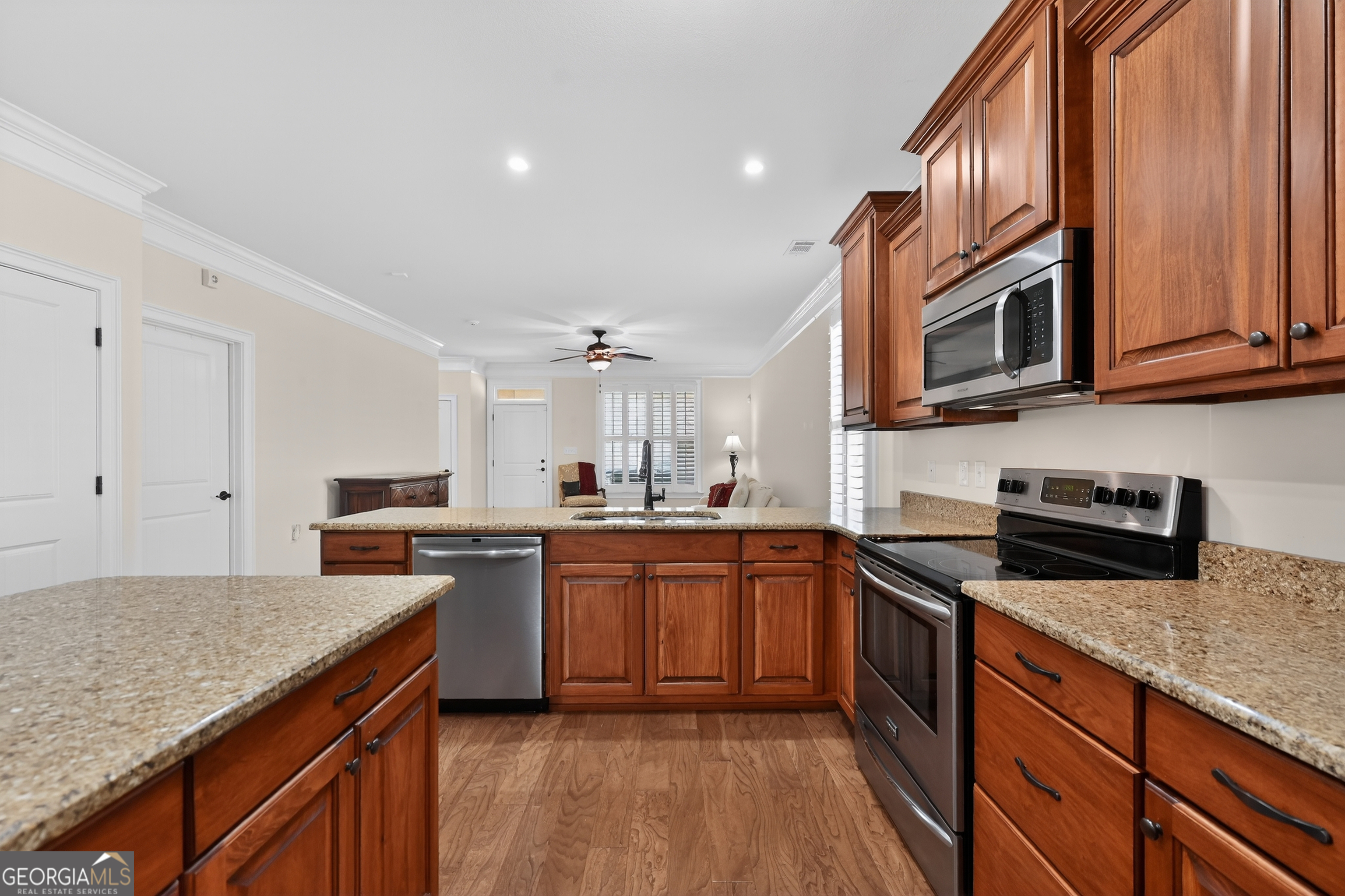 1617 Red Oak Lane Albany, GA 31701 - Photo 14 of 36 a kitchen with stainless steel appliances granite countertop sink stove top oven and cabinets