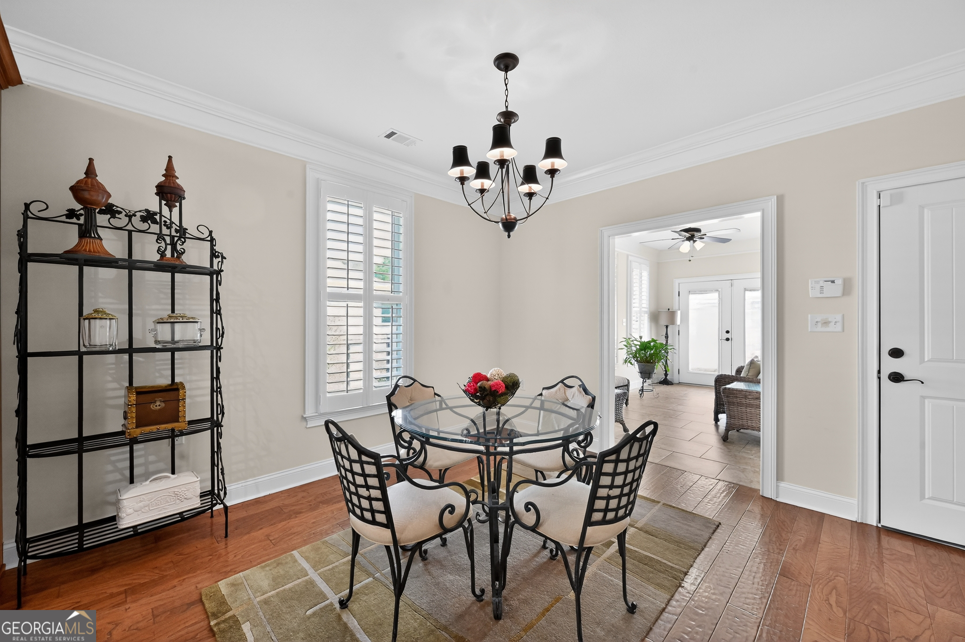 1617 Red Oak Lane Albany, GA 31701 - Photo 16 of 36 a dining room with furniture a chandelier and wooden floor