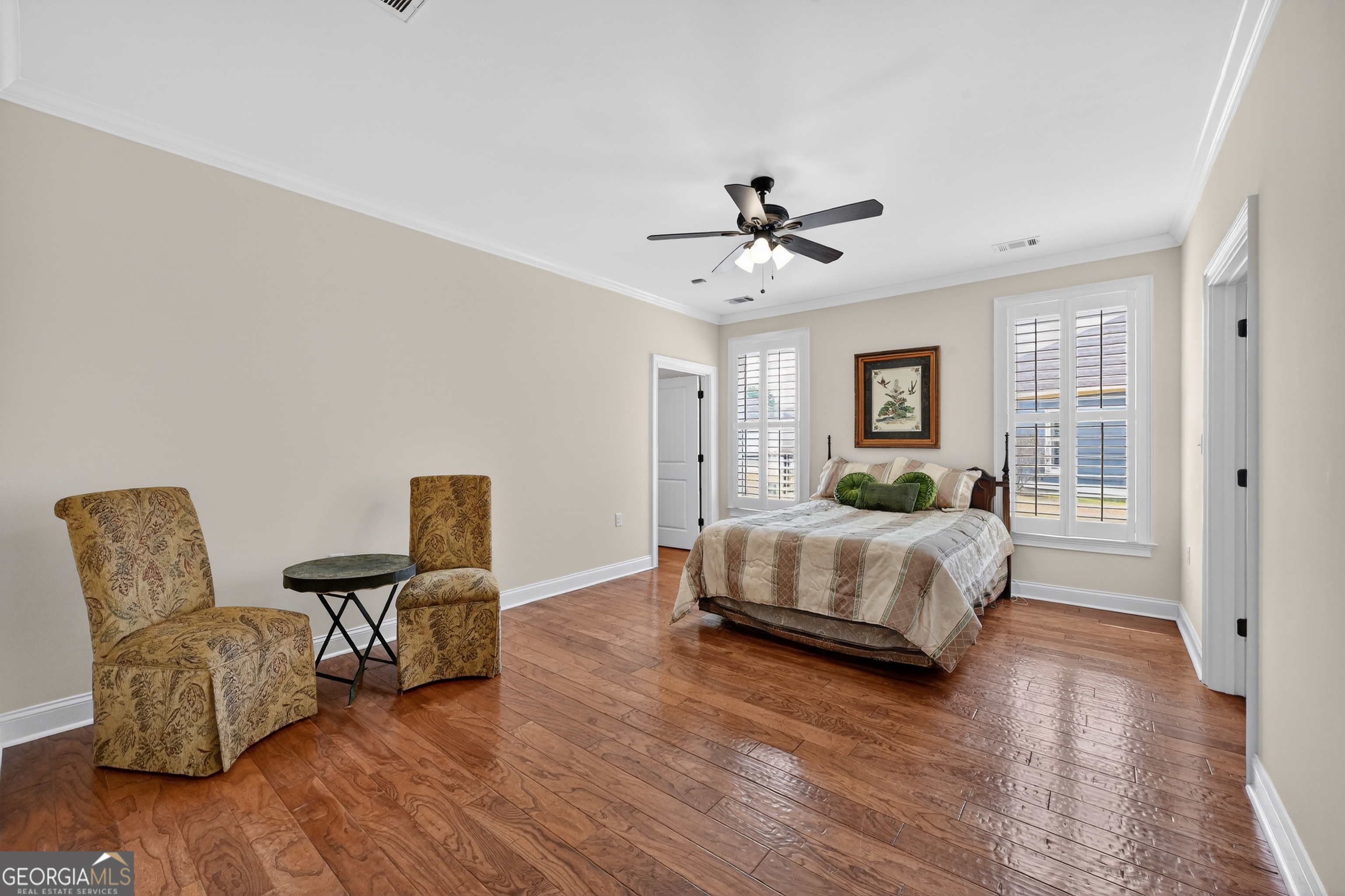 1617 Red Oak Lane Albany, GA 31701 - Photo 17 of 36 a bedroom with furniture and wooden floor