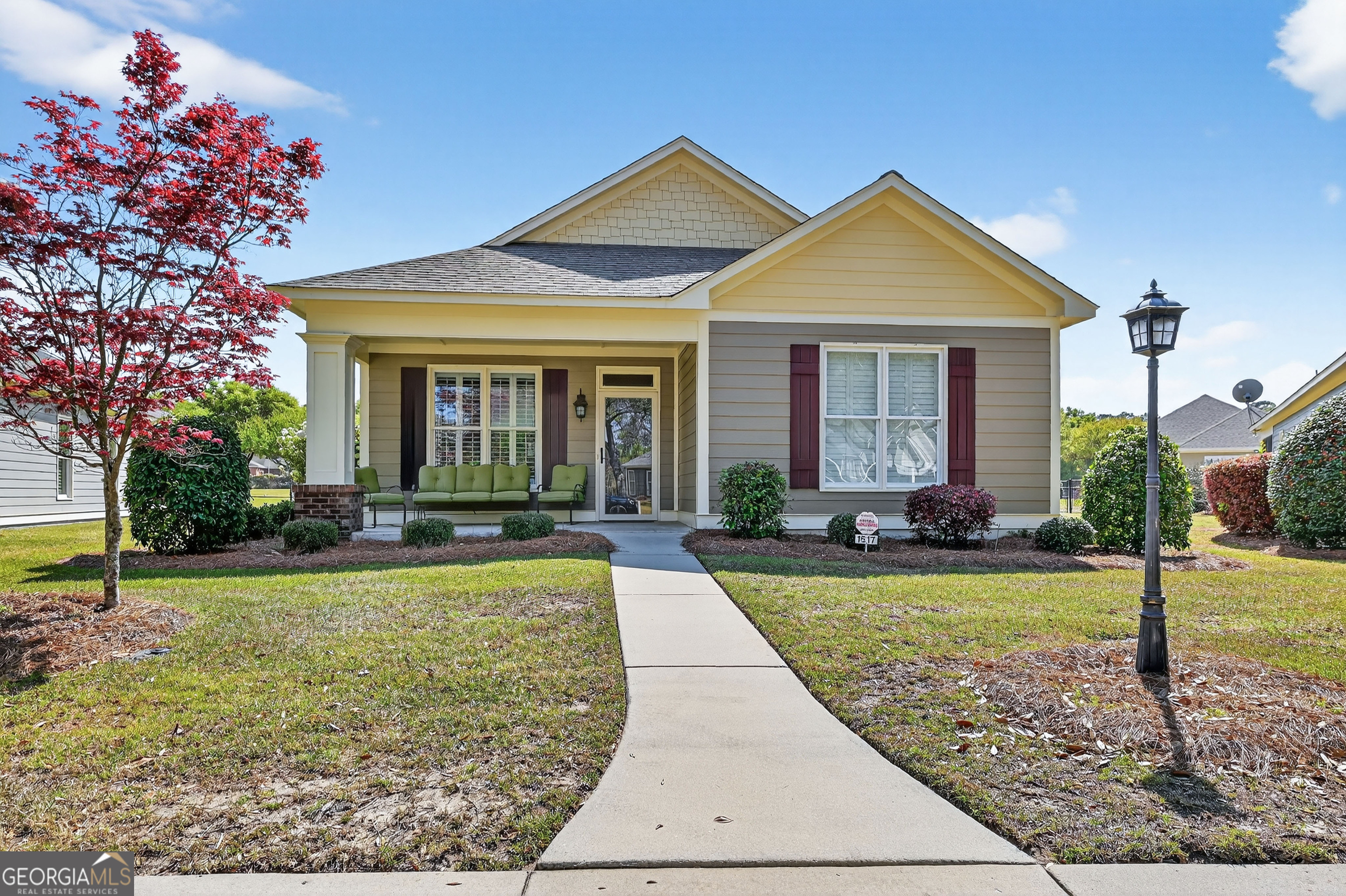 1617 Red Oak Lane Albany, GA 31701 - Photo 2 of 36 a front view of a house with garden