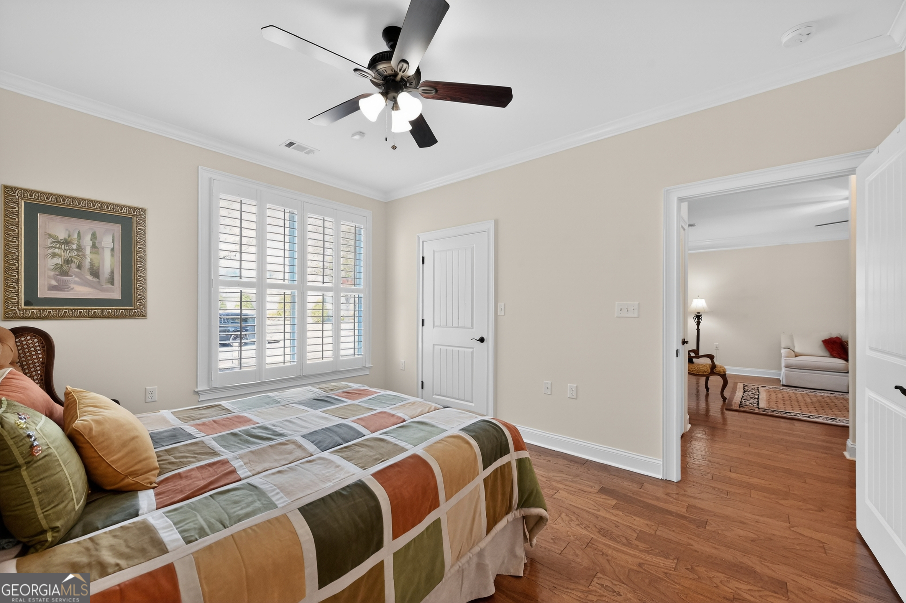 1617 Red Oak Lane Albany, GA 31701 - Photo 24 of 36 a bedroom with a large bed and a chandelier