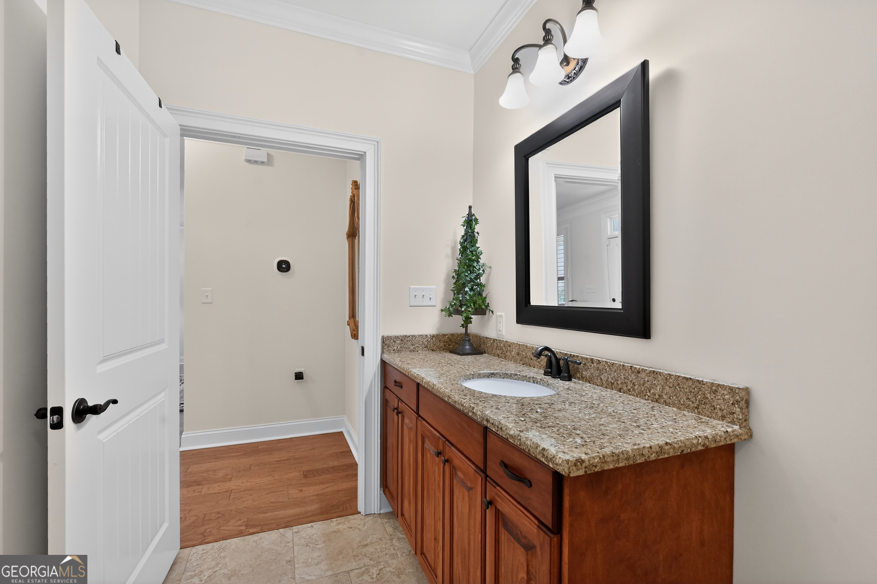 1617 Red Oak Lane Albany, GA 31701 - Photo 27 of 36 a bathroom with a granite countertop sink and a mirror