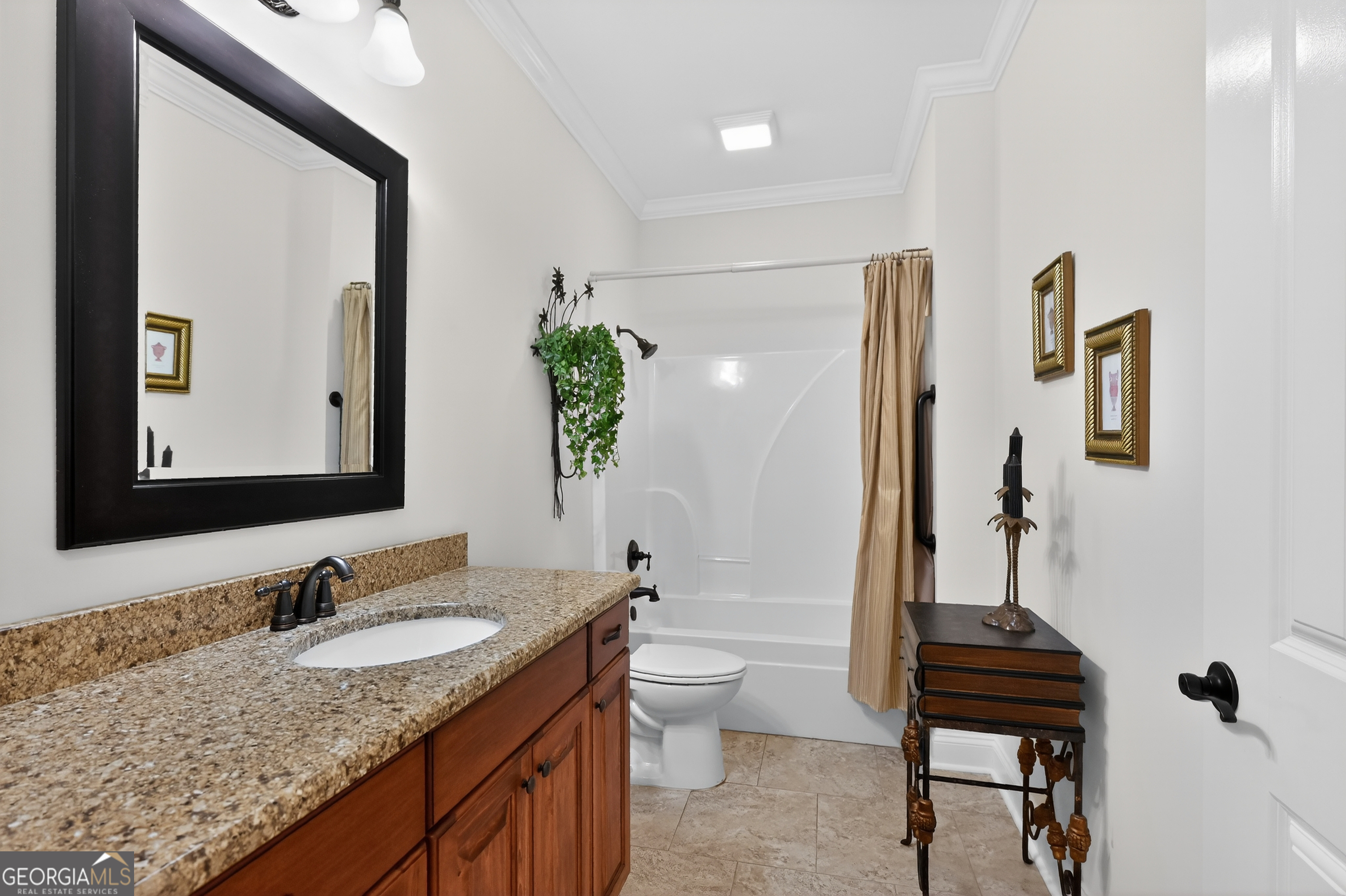1617 Red Oak Lane Albany, GA 31701 - Photo 28 of 36 a bathroom with a granite countertop sink and a mirror