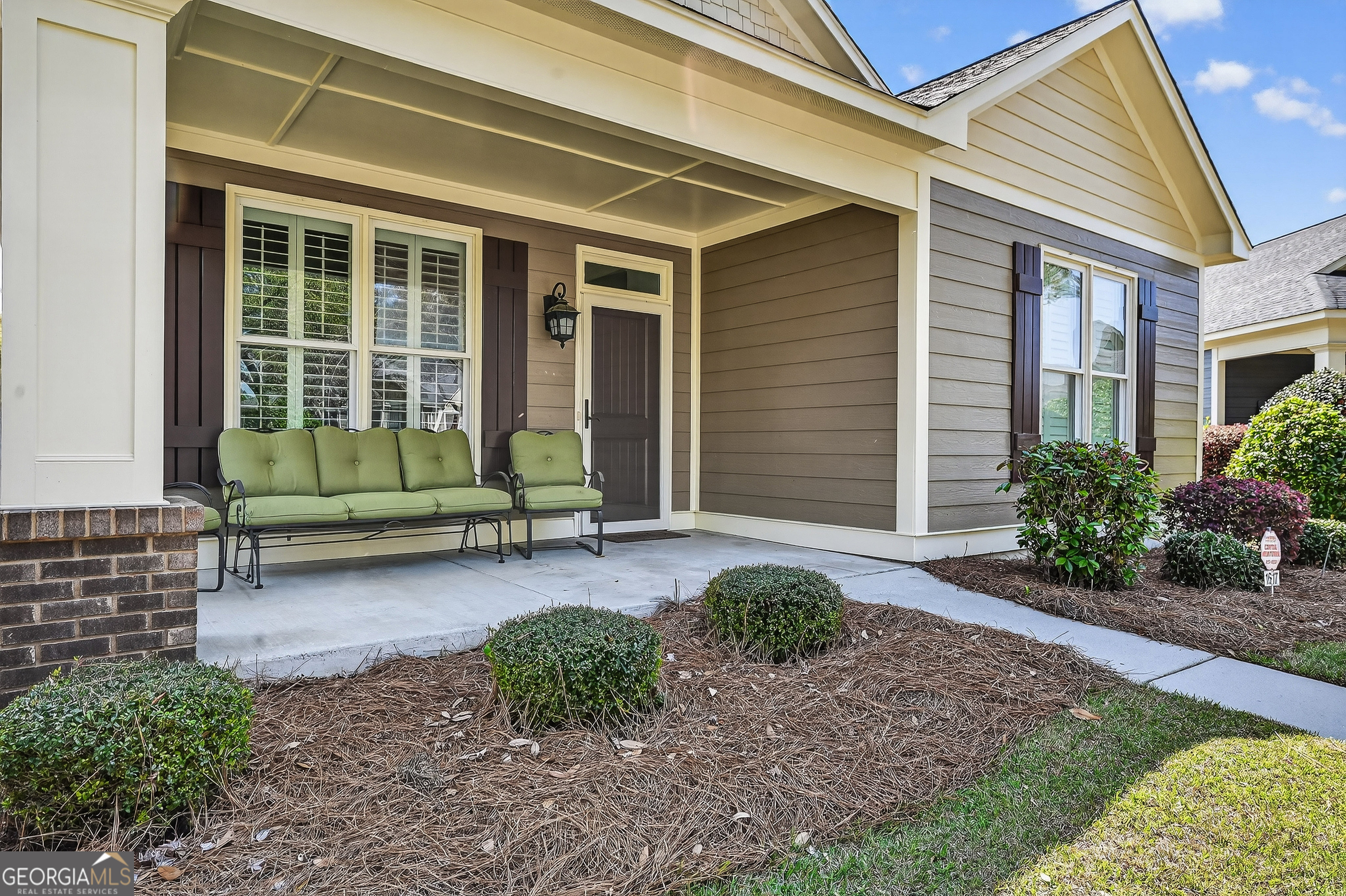 1617 Red Oak Lane Albany, GA 31701 - Photo 4 of 36 a house that has a big in front of it with potted plants