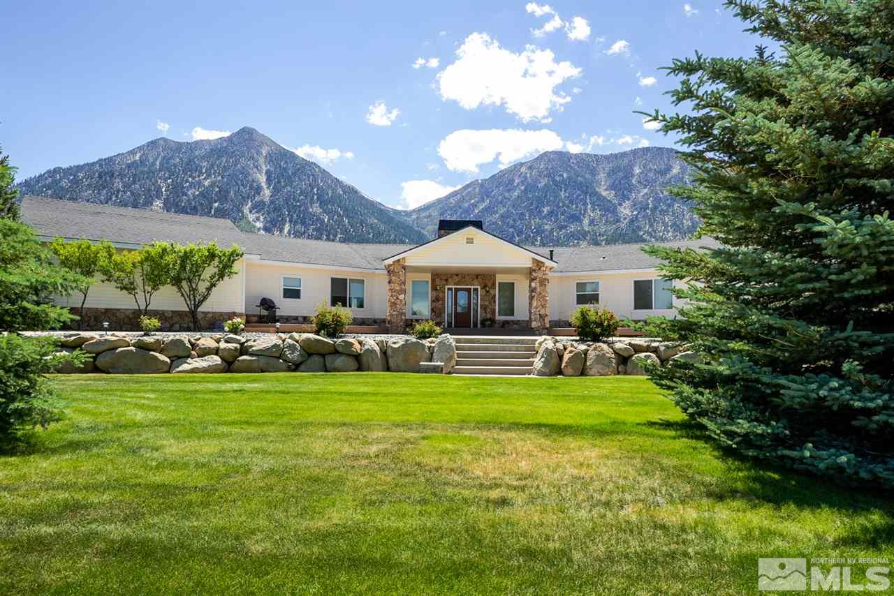 796 Foothill Road Gardnerville, NV 89460 - Photo 1 of 38 a front view of a house with a garden and plants