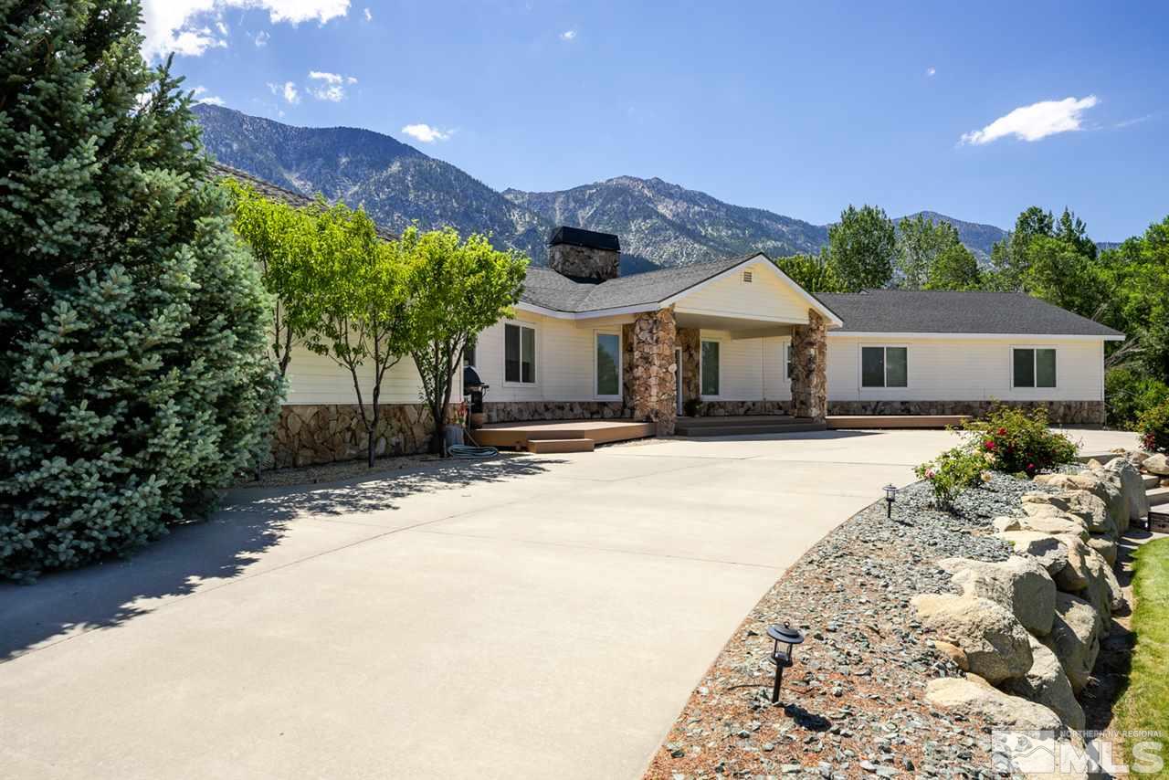 796 Foothill Road Gardnerville, NV 89460 - Photo 13 of 38 a front view of a house with a yard and garage