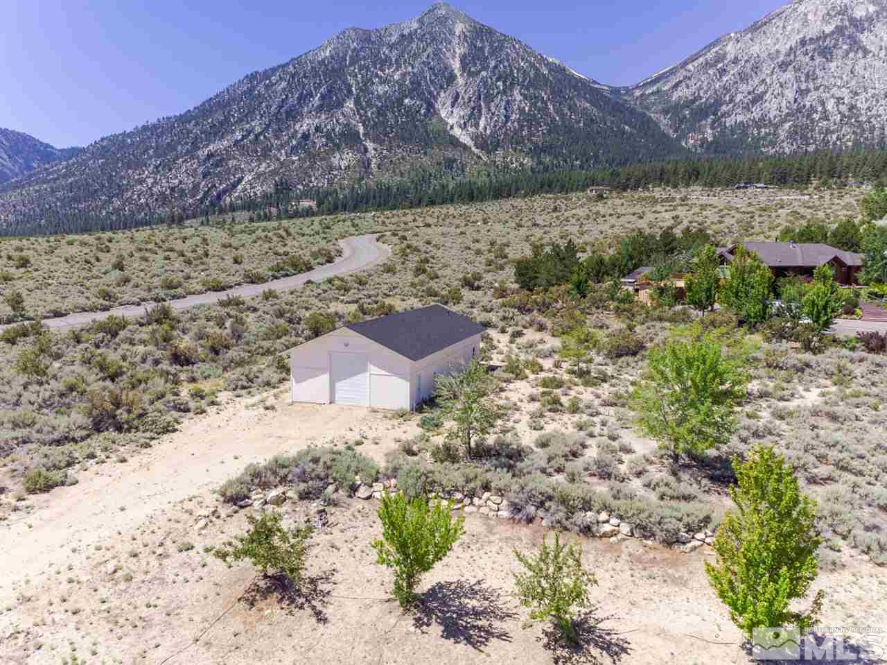 796 Foothill Road Gardnerville, NV 89460 - Photo 18 of 38 a view of a yard with a mountain