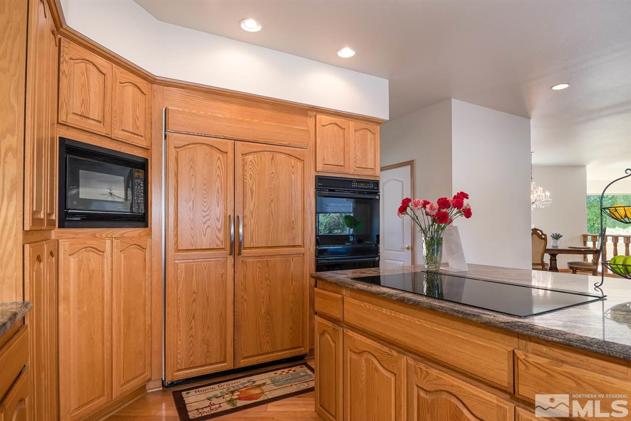 796 Foothill Road Gardnerville, NV 89460 - Photo 19 of 38 a kitchen with sink cabinets and microwave