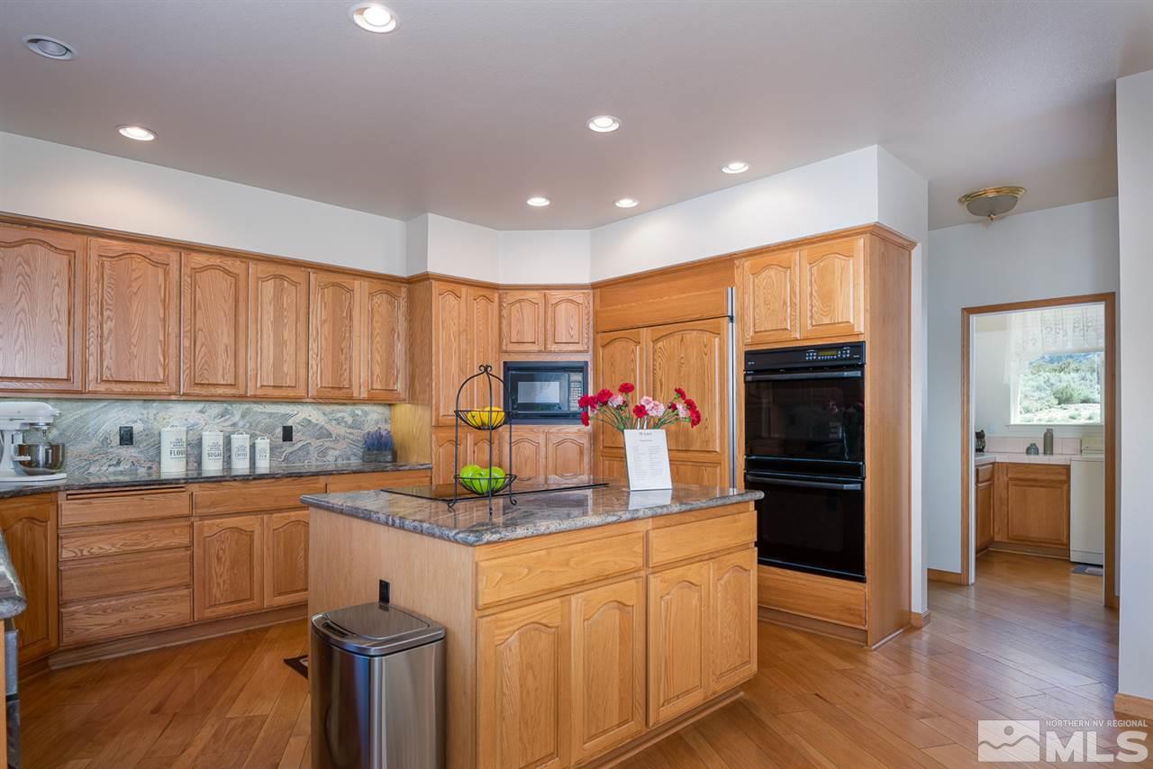 796 Foothill Road Gardnerville, NV 89460 - Photo 20 of 38 a kitchen with stainless steel appliances granite countertop a refrigerator sink and cabinets