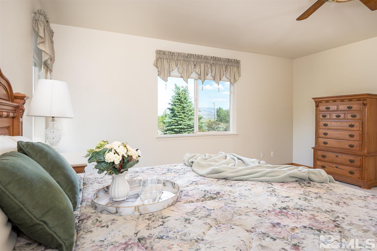 796 Foothill Road Gardnerville, NV 89460 - Photo 24 of 38 a bedroom with a bed and a window