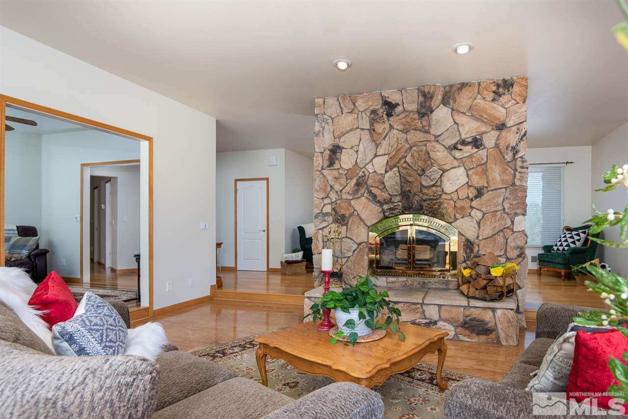796 Foothill Road Gardnerville, NV 89460 - Photo 32 of 38 a living room with furniture and a chandelier
