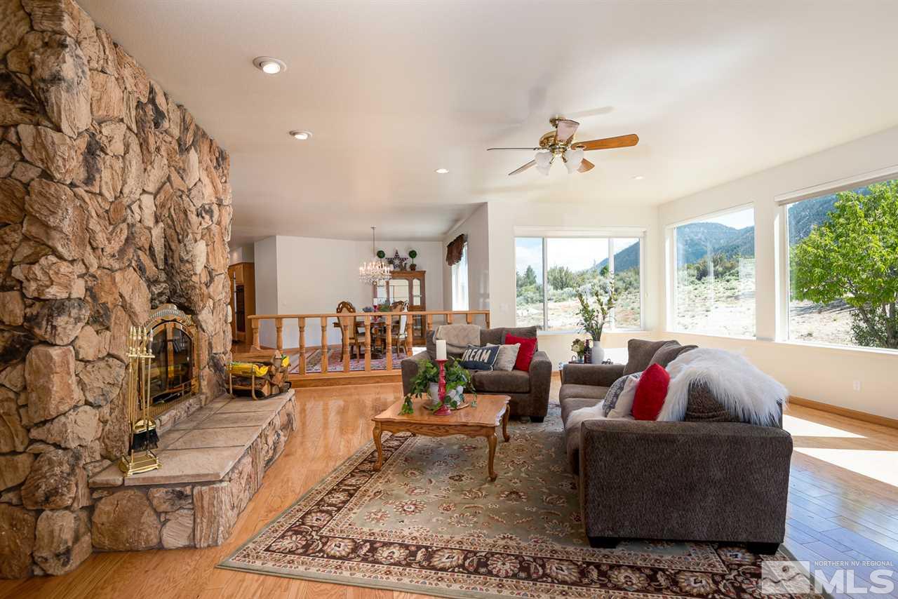 796 Foothill Road Gardnerville, NV 89460 - Photo 33 of 38 a living room with fireplace furniture and a large window